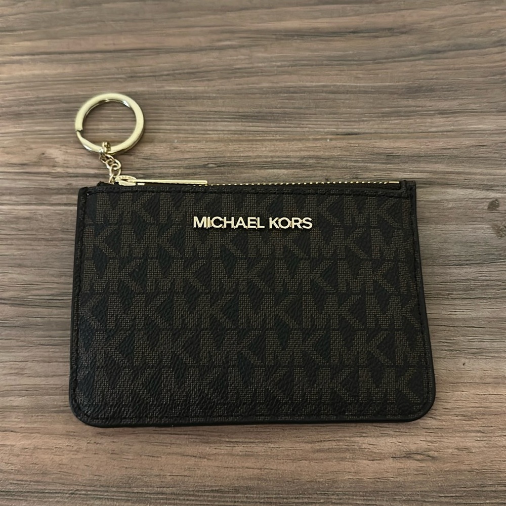 Michael kohrs mini wallet with lots of card space and holder for change
